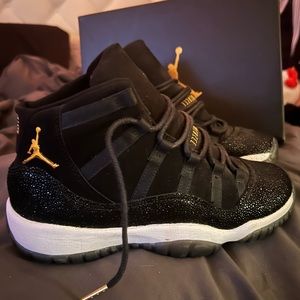Jordan Retro 11s black/metallic gold